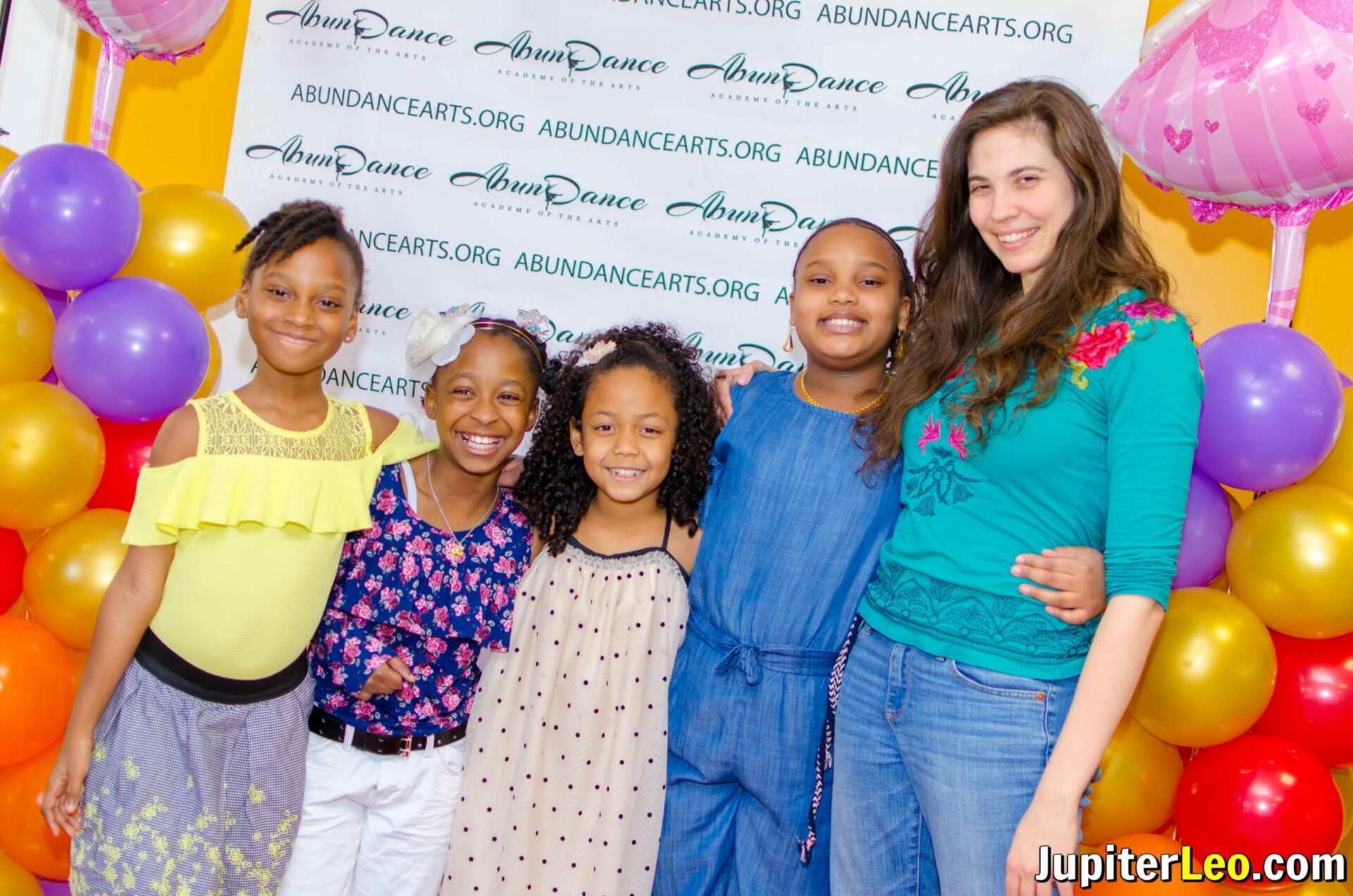 Group photo of dance instructor with her students.