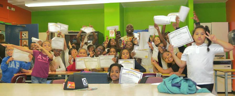 A class of third grade students that received certificates dor coding class.