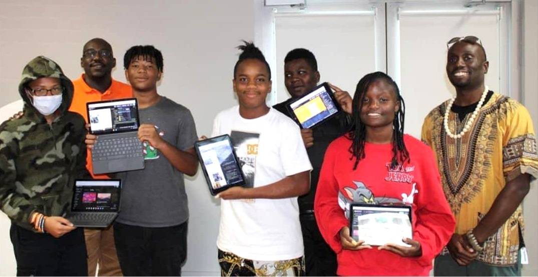 High school students that display their websites with EJS Project Founder and instructor.